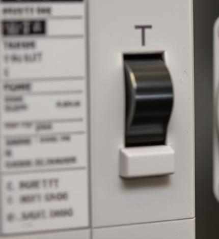 A close-up of a circuit breaker with a tripped switch, corroded wiring, and a power outlet showing voltage drop, illustrating common causes of low voltage.