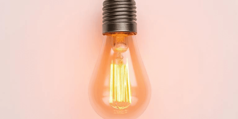A technical image showing a loose light bulb in a socket, an LED bulb next to a dimmer switch, and electrical panel wiring, illustrating common causes of light flickering.